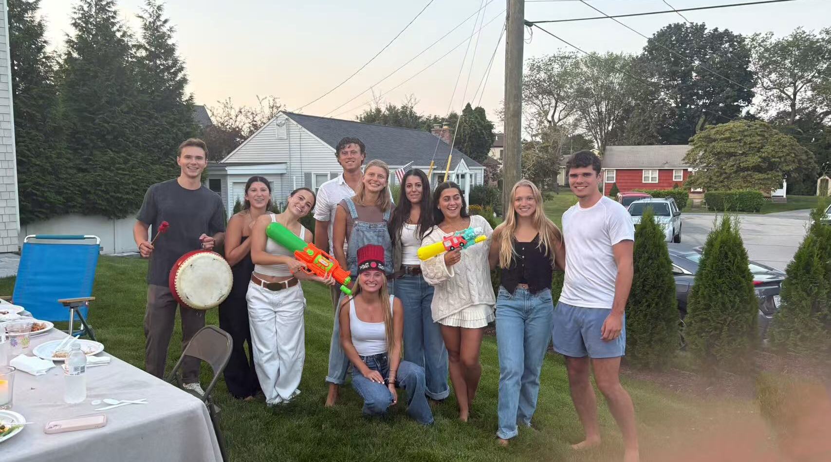 Friends celebrating at a backyard hibachi party