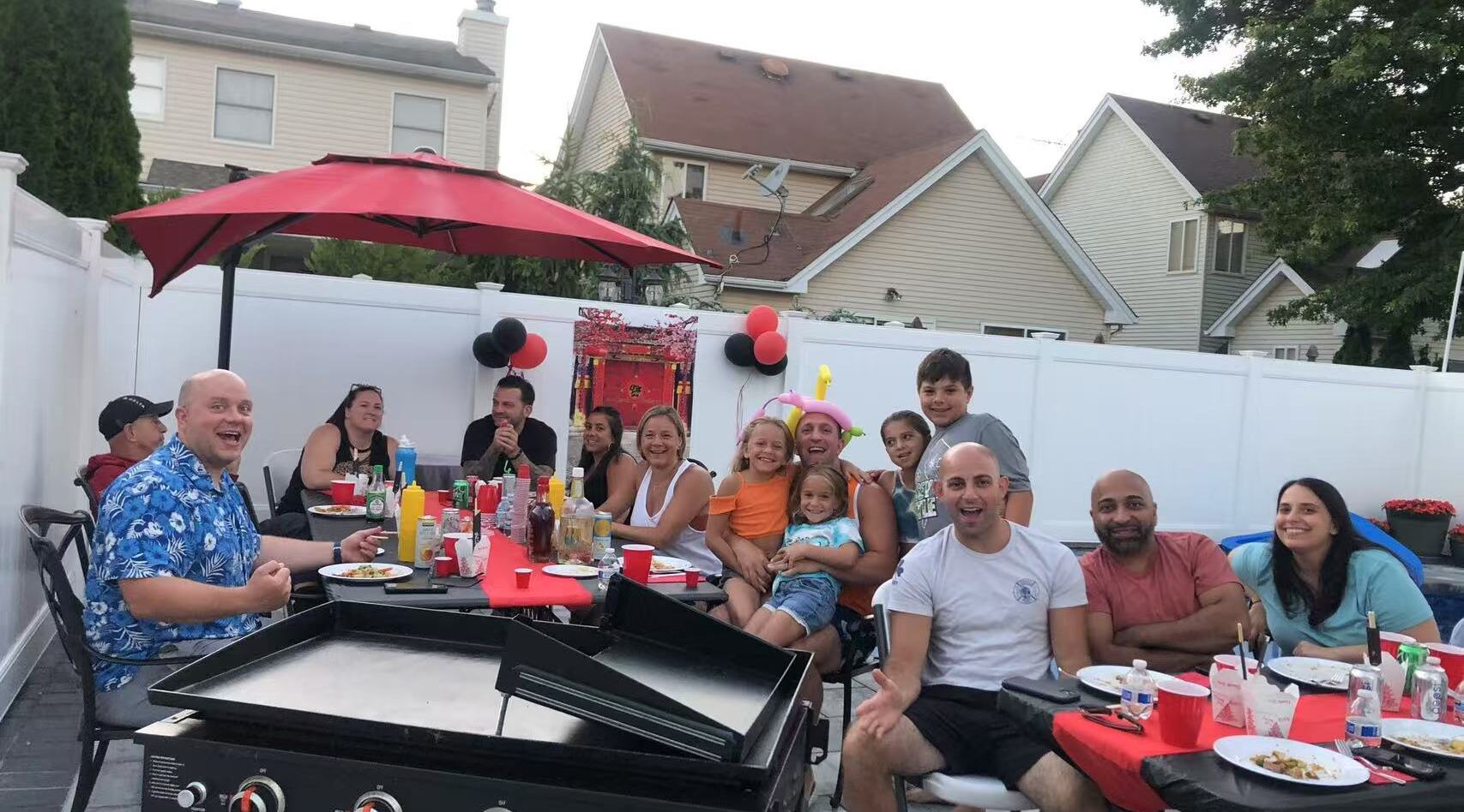 Group celebrating a graduation dinner outdoors