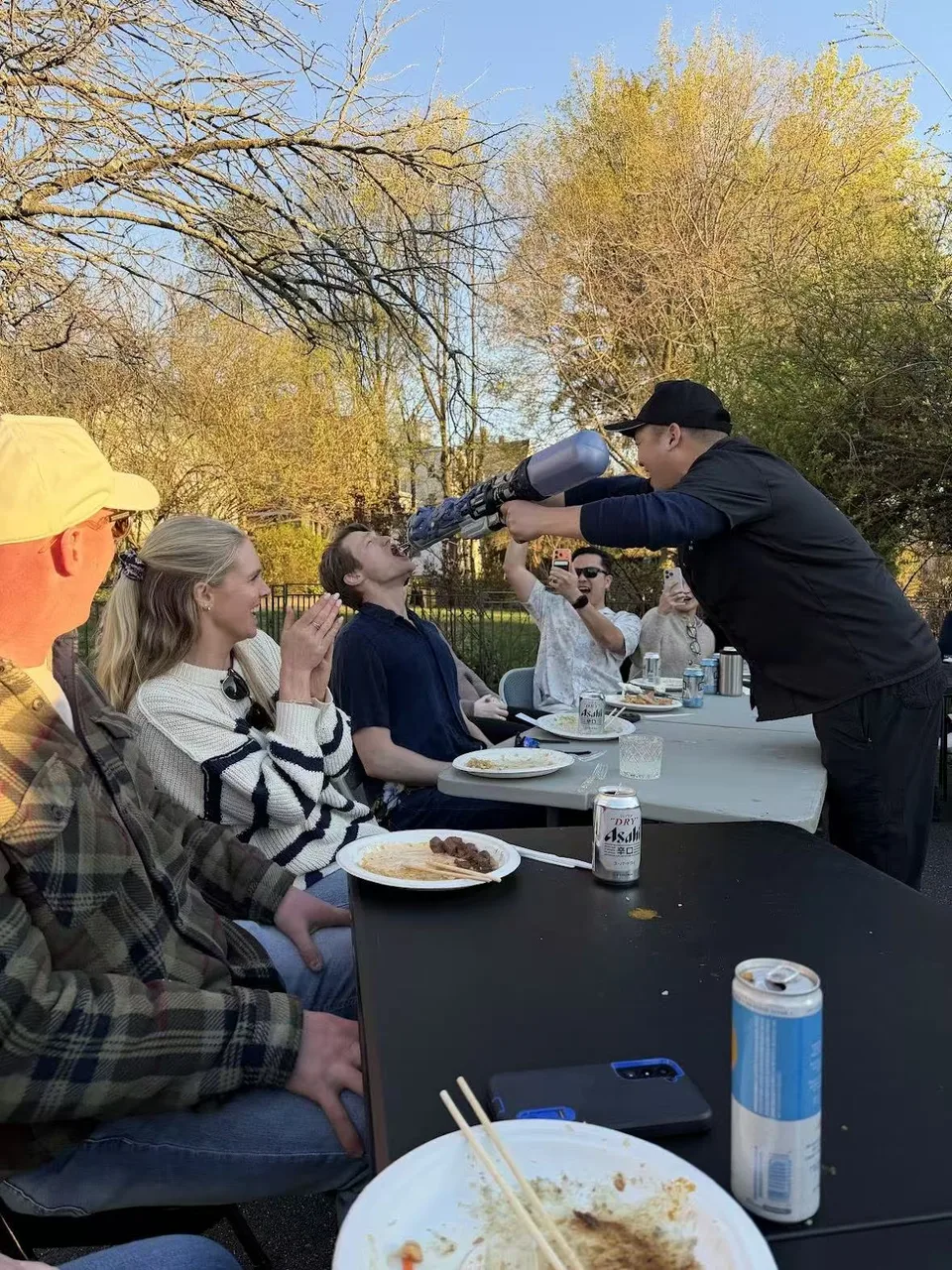 Chef performing a pour trick for a guest